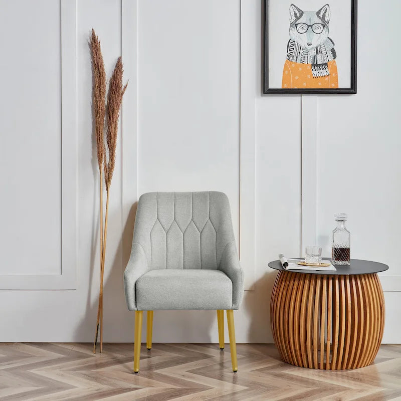 Sedia d'accento imbottita Glam con gambe in metallo dorato o nero